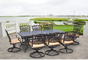 Cast Aluminum dining set with 8 chairs and Tan Cushions